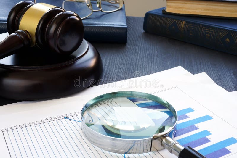 Financial crime. Gavel and Magnifying glass with business documents. Fraud concept. Financial crime. Gavel and Magnifying glass with business documents. Fraud concept.