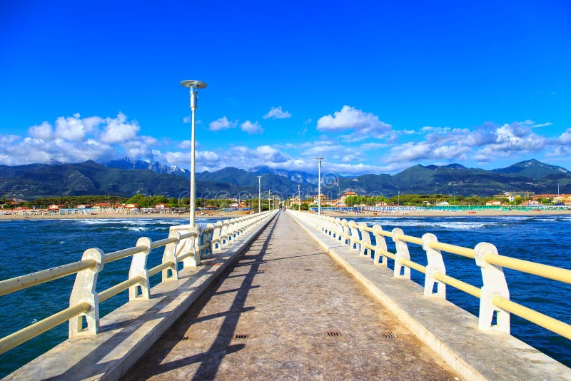 Pier, beach and Apuane mountains in Forte dei Marmi Versilia Tuscany Italy