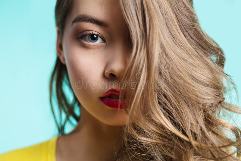 The piercing gaze of the girl. Close up portrait of a beautiful woman looking at camera stock photo The piercing gaze of the girl. Close up portrait of a beautiful woman looking at camera stock photo
