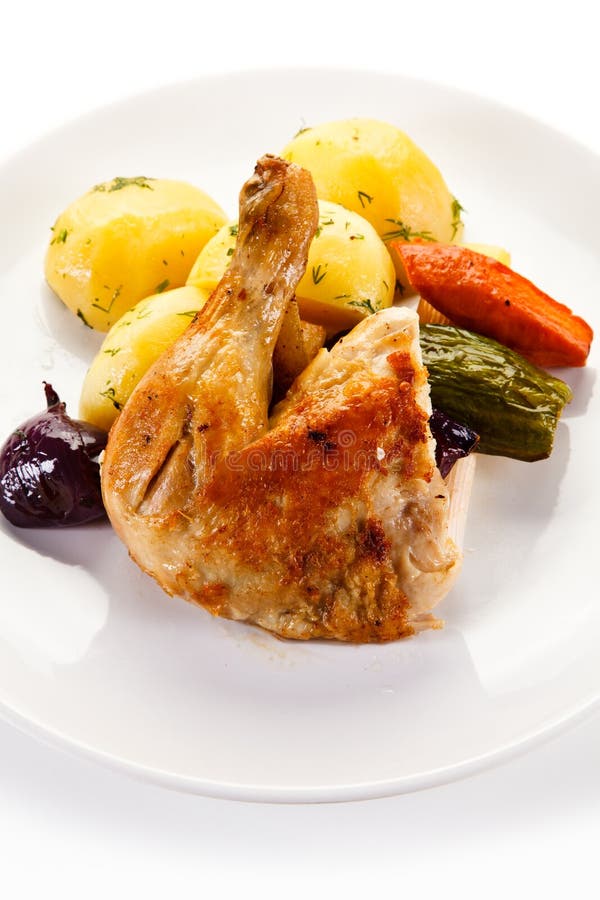Pierna de pollo asado con las patatas imagenes de archivo Pierna de pollo asado con las patatas imagenes de archivo