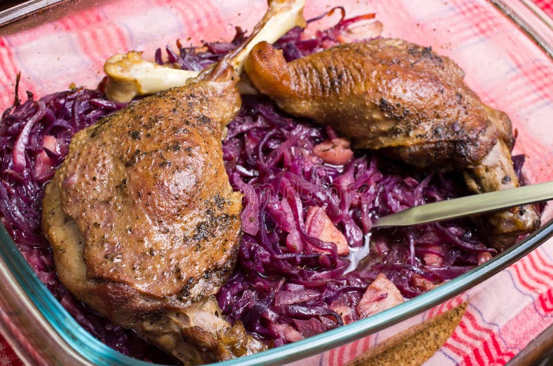 Delicious goose legs baked on red cabbage. Delicious goose legs baked on red cabbage