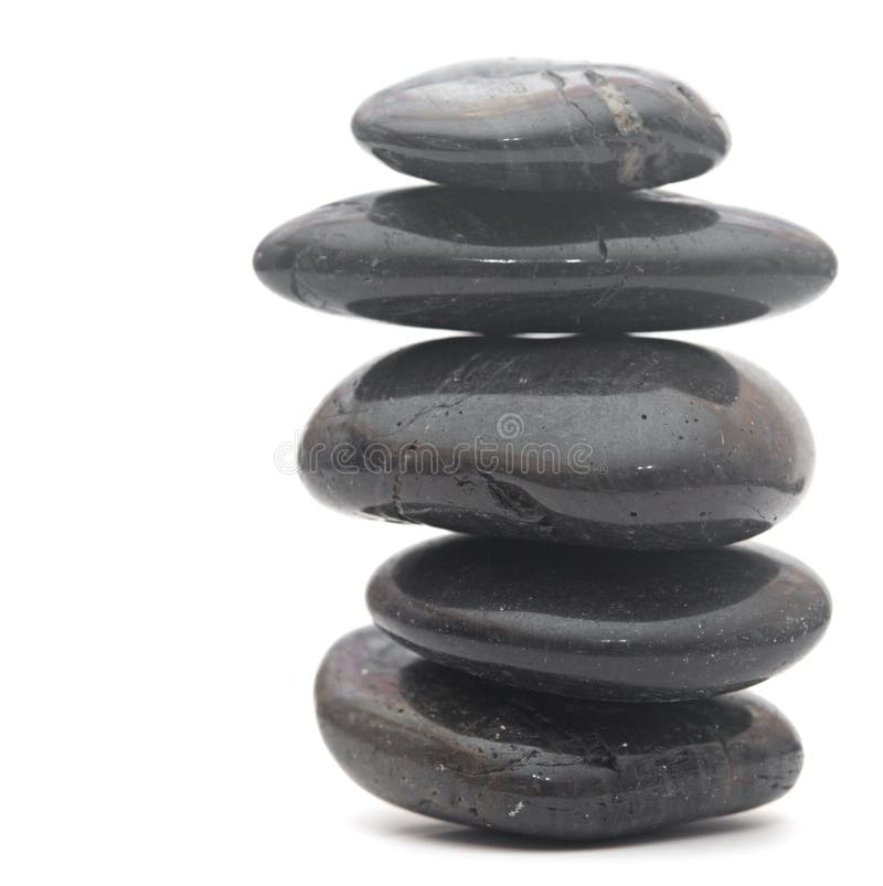 Pierres noires de massage empilées photos stock Pierres noires de massage empilées photos stock
