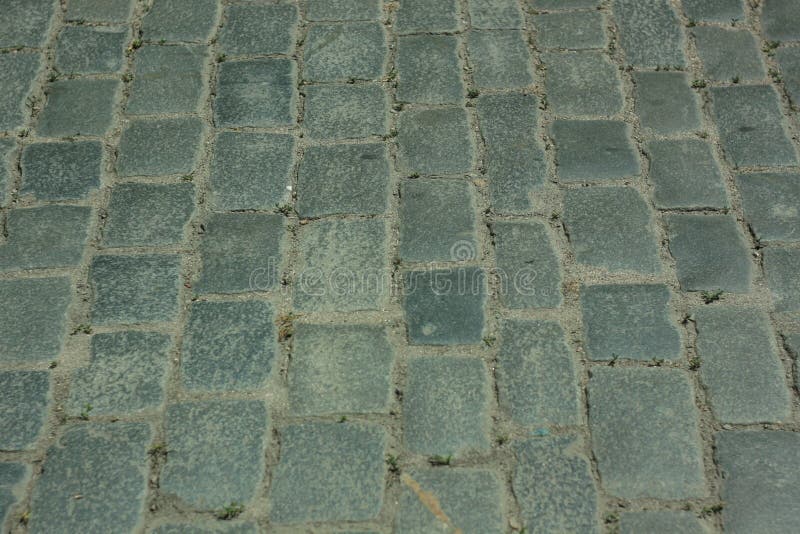 Pietre da pavimentazione antiquate Piastre di pavimentazione, architettura antica, vista superiore sulla strada fotografia stock Pietre da pavimentazione antiquate Piastre di pavimentazione, architettura antica, vista superiore sulla strada fotografia stock