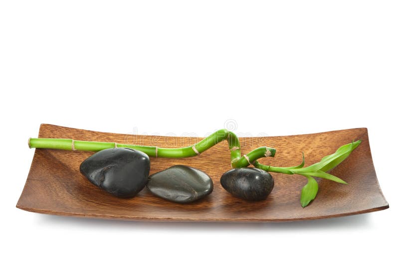Pietre da spa e bambù isolati fotografie stock libere da diritti