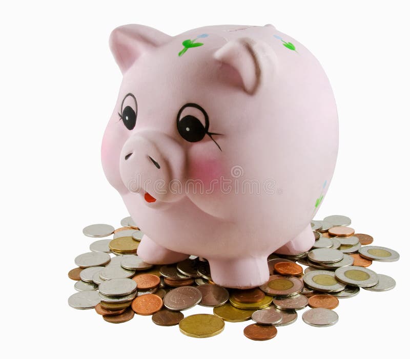 Piggy bank on pile of coins isolated in white.