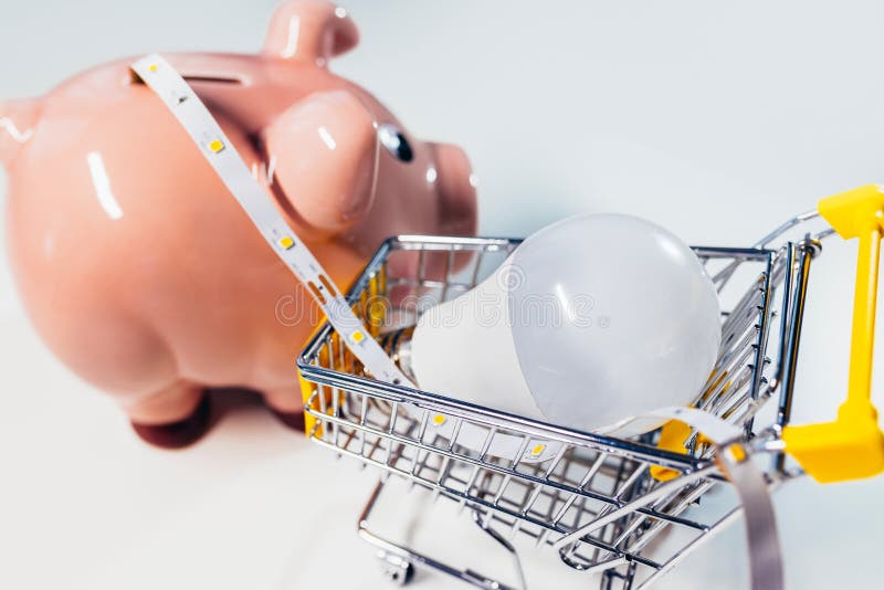 piggy-bank-with-light-bulb-and-led-light-strip-saving-energy-stock