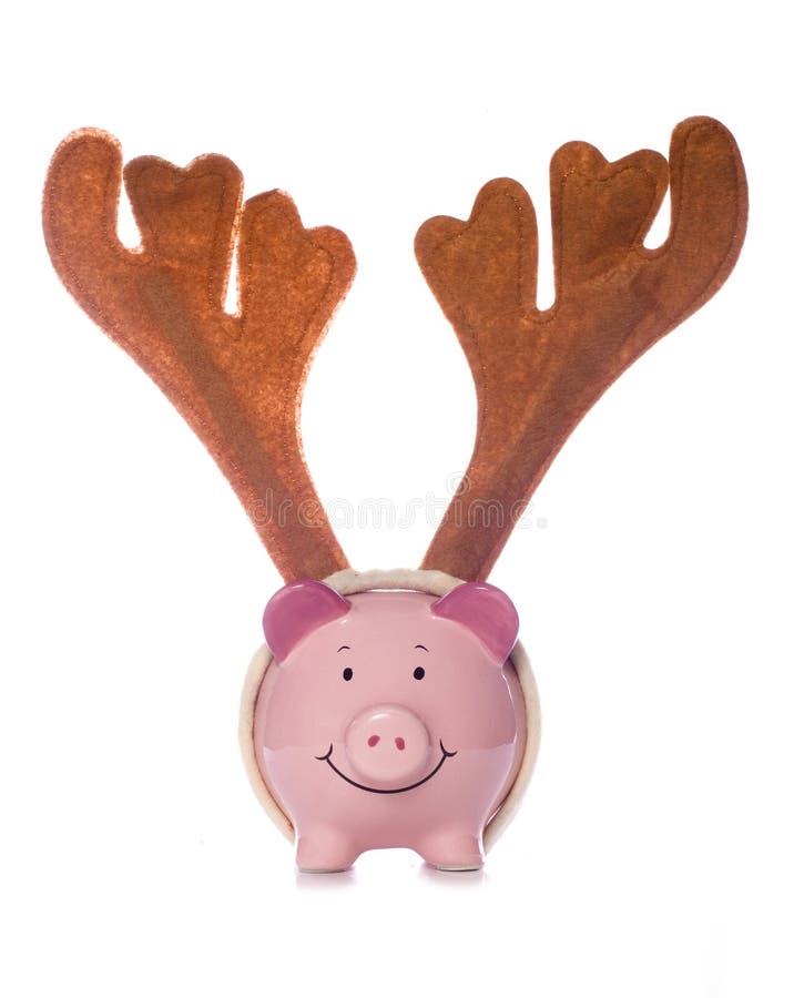 Piggy bank wearing christmas reindeer antlers cutout