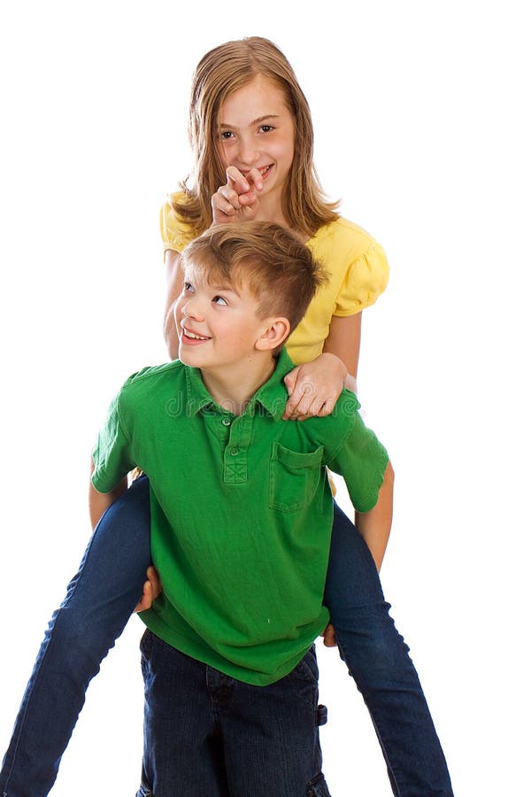 Man giving boy piggyback ride Man giving boy piggy back ride against white  background, model