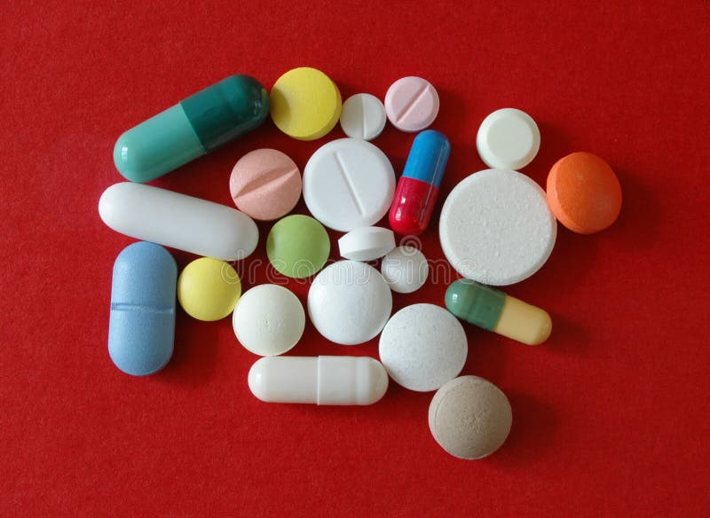 Set of pills on a red background. Set of pills on a red background.