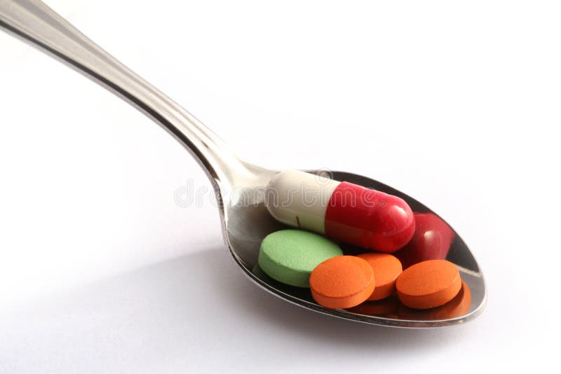 Pills in spoon (with clipping path). Pills in spoon (with clipping path)