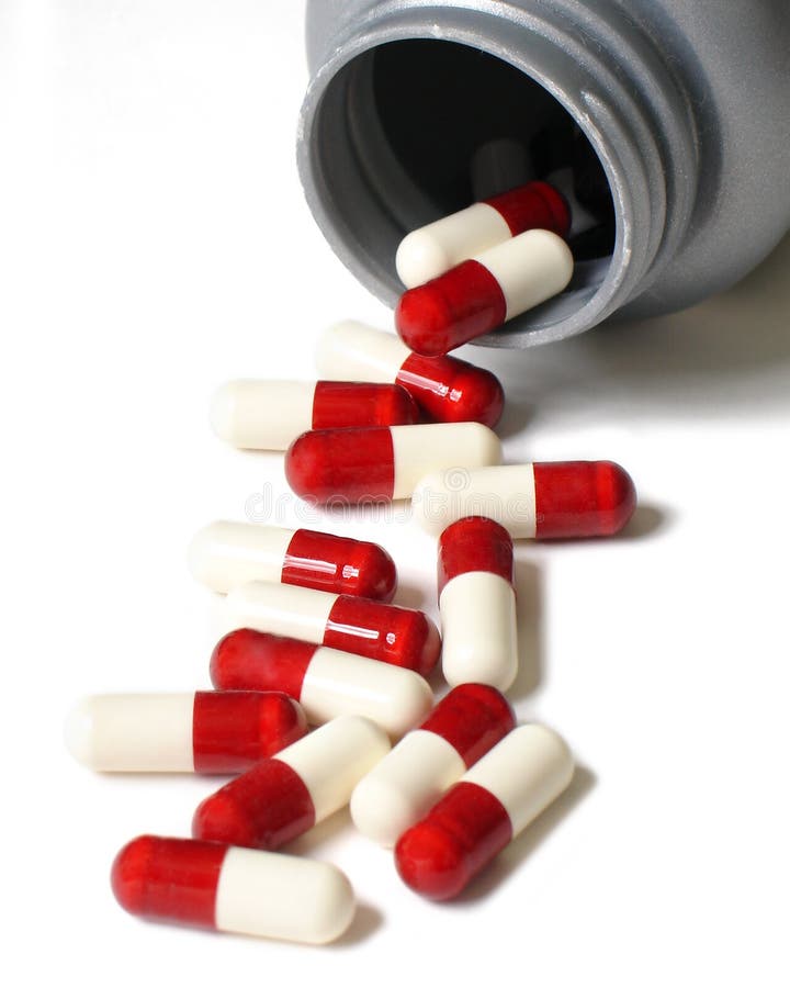 Pills and bottle on a white background. Pills and bottle on a white background