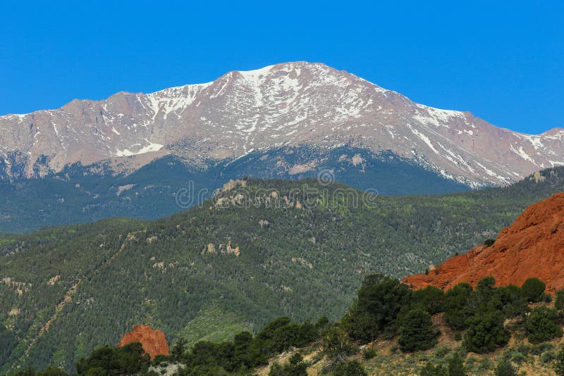 Pike`s Peak in Colorado is over 14,000 feet in elevation as viewed near the Garden of the Gods entrance in Colorado Springs. Pike`s Peak in Colorado is over 14,000 feet in elevation as viewed near the Garden of the Gods entrance in Colorado Springs