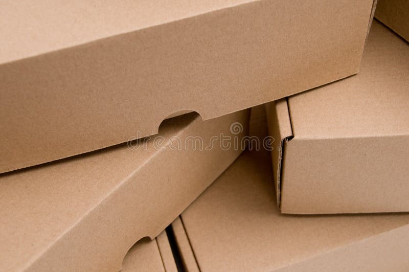 A stack of brown cardboard boxes. A stack of brown cardboard boxes.