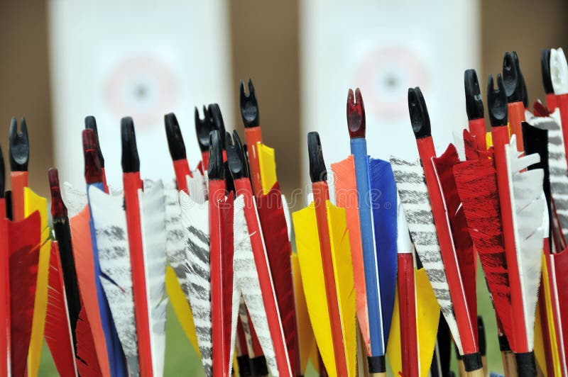 Colorful arrows with targets in the background. Colorful arrows with targets in the background