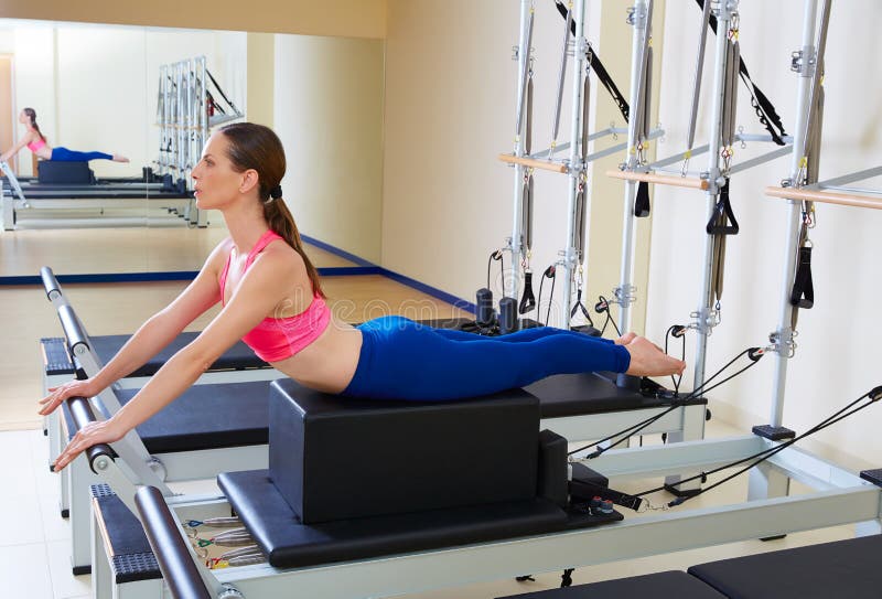 Mature Man Exercising On Pilates Reformer Short Box During Class In Fitness  Studio High-Res Stock Photo - Getty Images