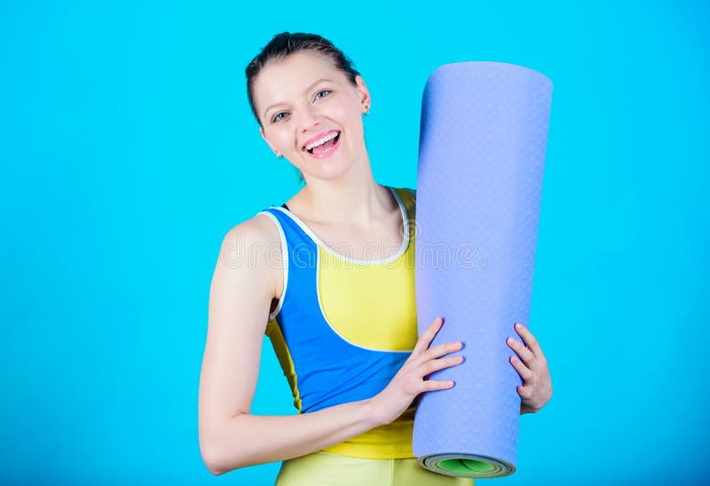 Pilates. Success. Sport mat equipment. Athletic fitness. Sporty woman training in gym. Strong muscles and power. Happy stock image