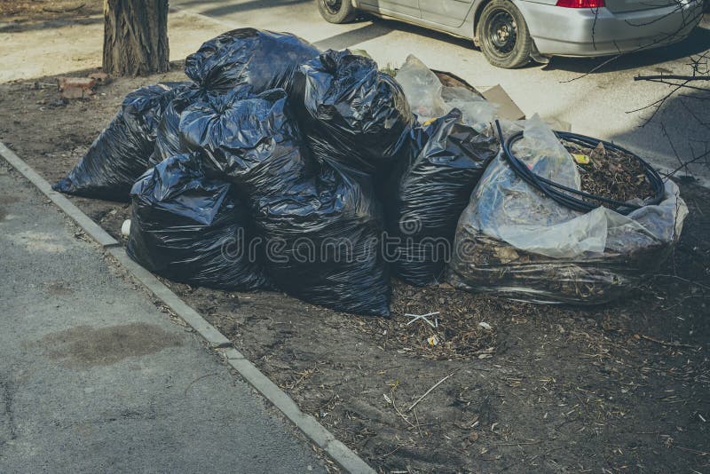 Pile Of Black Garbage Bag On The Street Stock Photo, Picture and Royalty  Free Image. Image 39347140.