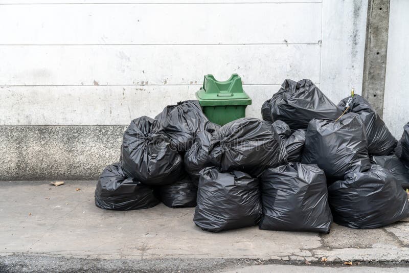 Garbage bags. Waste, black garbage bags plastic pile stack. Lots pile of garbage  bags stack. by KYNA STUDIO. Photo stock - StudioNow