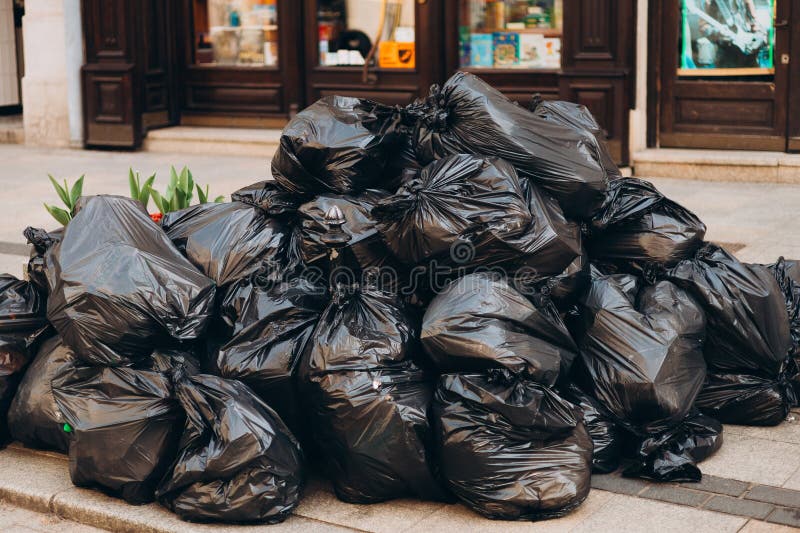 Big Black Plastic Garbage Bag and Bones Near Stock Image - Image of junk,  isolated: 152310773