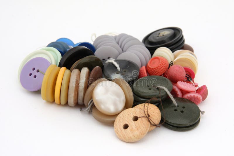 Pile of buttons cloth stock photography