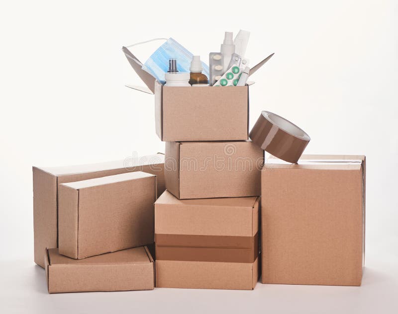 Pile of cardboard boxes with various medicines and adhesive tape