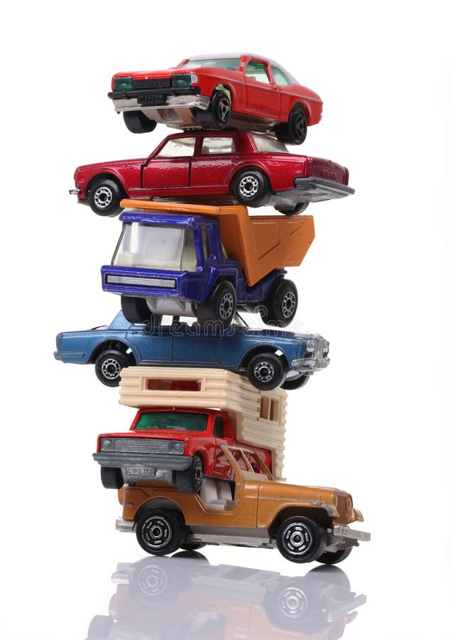Pile of toy cars isolated on white vertical shot. Cars stock imagesroyalty-free photos and pictures