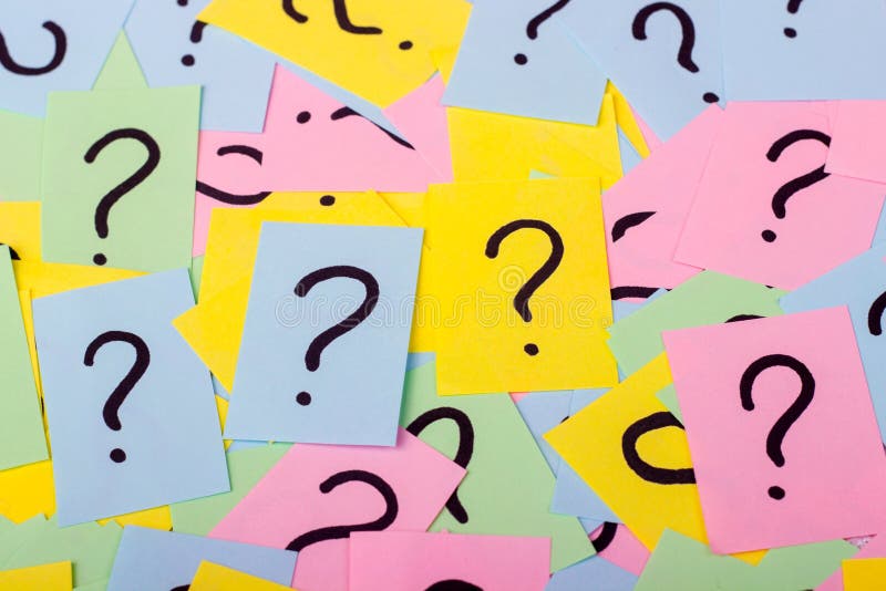 Pile of colorful paper notes with question marks. Closeup stock images Pile of colorful paper notes with question marks. Closeup stock images