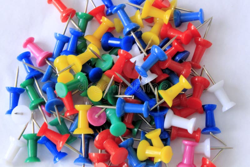 A Pile of Colorful Push Pins on a White Background royalty free stock photography A Pile of Colorful Push Pins on a White Background royalty free stock photography