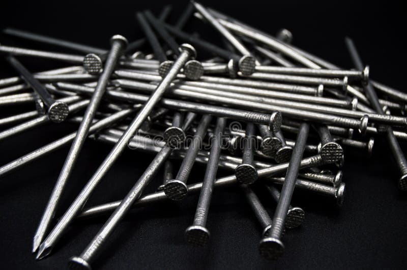 Pile of Construction Iron Nails on a Black Background Stock Photo ...