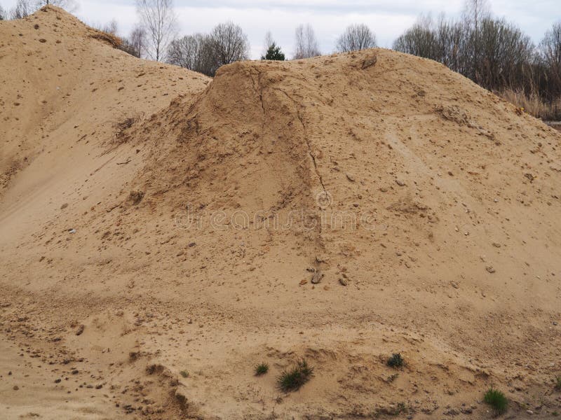 Pile of construction sand stock photo. Image of closeup - 183885138