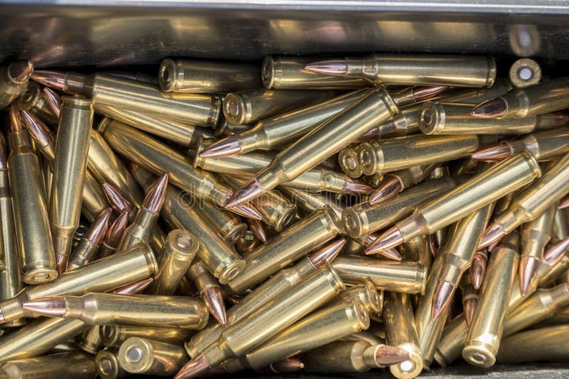 A pile of copper bullets of a gun used in shooting activity