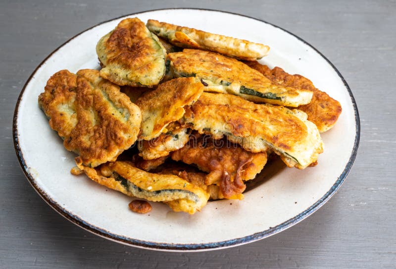 A Pile of Courgette Fritters in Batter in a Plate on Grey Table Stock Photo Image of cooking