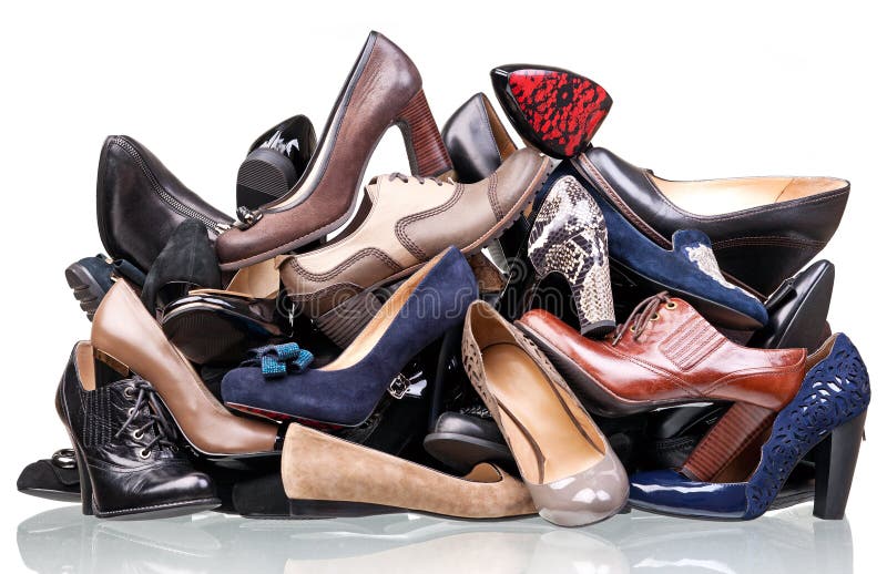 Pile of various female shoes over white background. Pile of various female shoes over white background