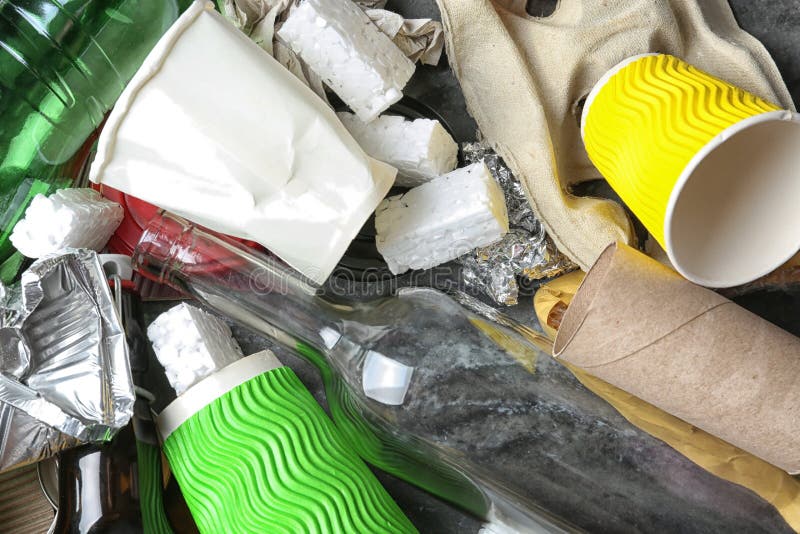 Pile of different garbage as background, top view. Recycling problem