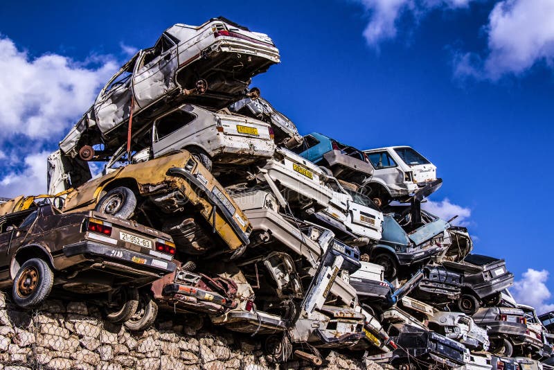 Pile of discarded old cars on junkyard