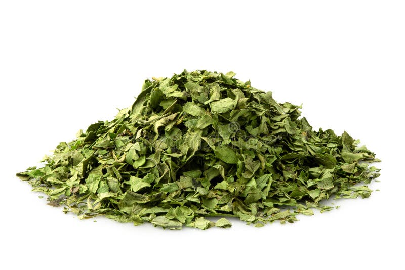 A Pile of Dried Chopped Coriander Leaves Isolated on White Stock Photo