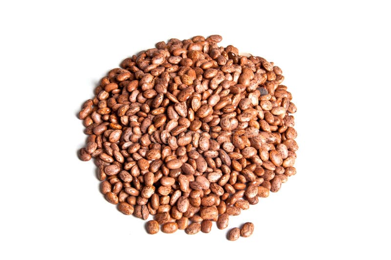 Pile of dried pinto beans, isolated.