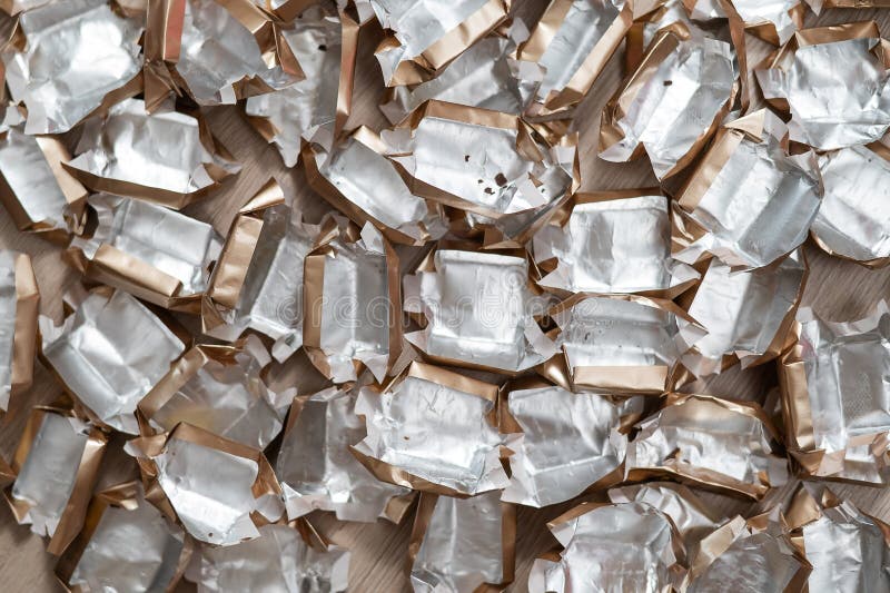 Pile of Empty Silvergold Candy Wrappers. Top View. Stock Image Image