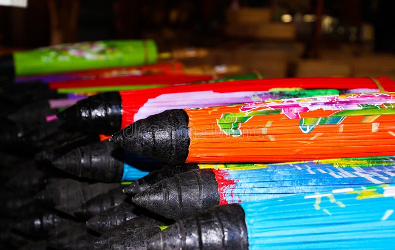 Pile of folded paper umbrellas in Chiang Mai, Thailand stock photos Pile of folded paper umbrellas in Chiang Mai, Thailand stock photos