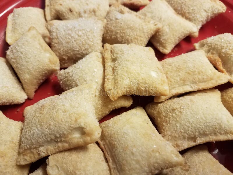 Pile of Frozen Pizza Rolls on Red Plate Stock Image Image of cold