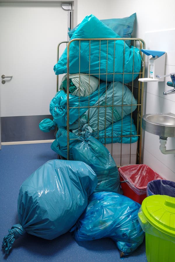 A Pile of Garbage Bags Piled Up in a Storage Room Stock Photo Image