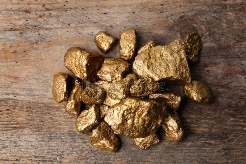 Pile Of Gold Nuggets On Wooden Background Stock Image Image of