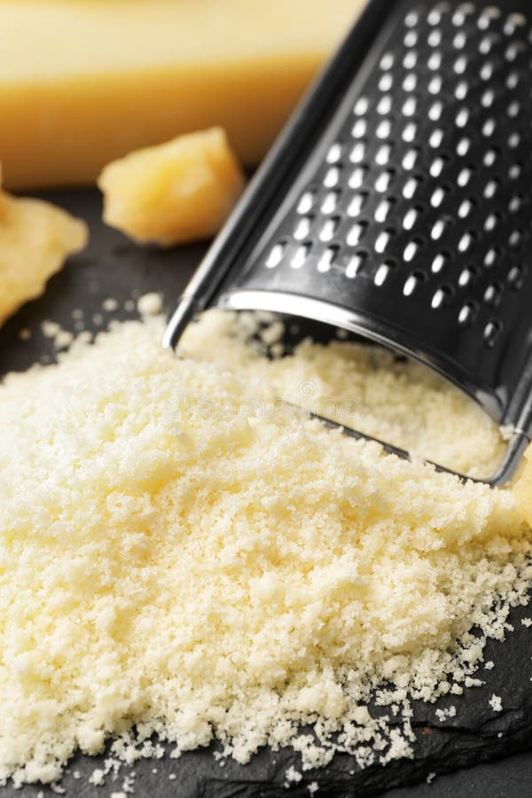 Pile of Grated Parmesan Cheese and Grater on Black Table, Closeup Stock Image Image of cheese