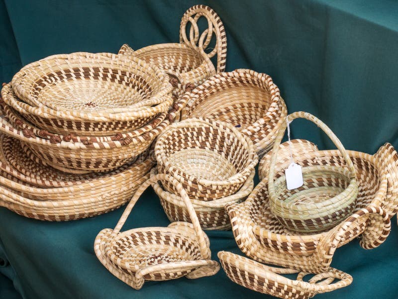 Pile of handcrafted sweet grass baskets for sale
