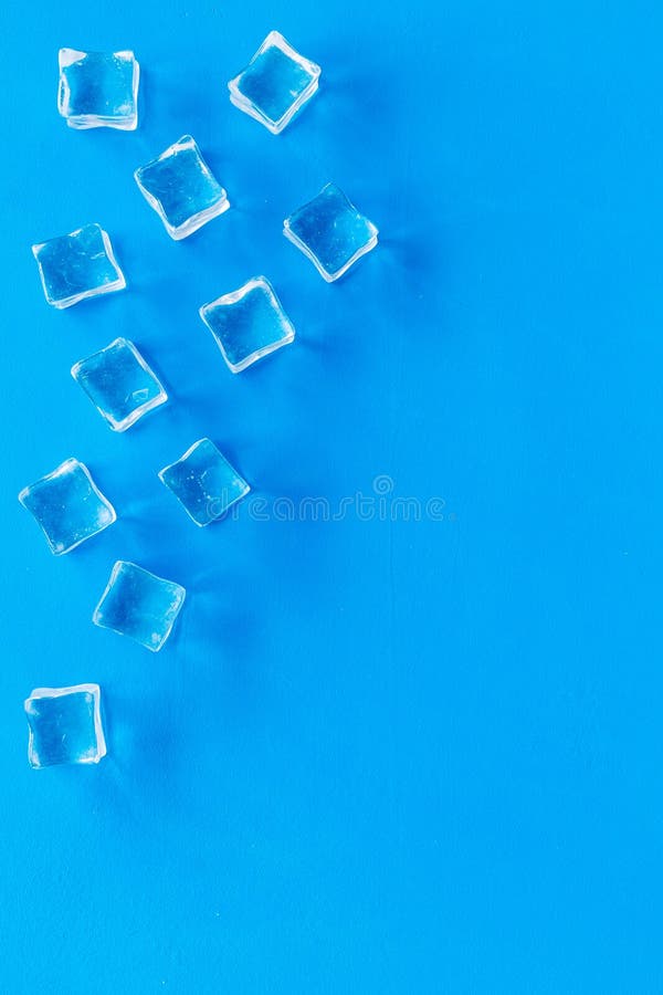 Pile Of Ice Cubes On Blue Bar Desk Background Top View ...