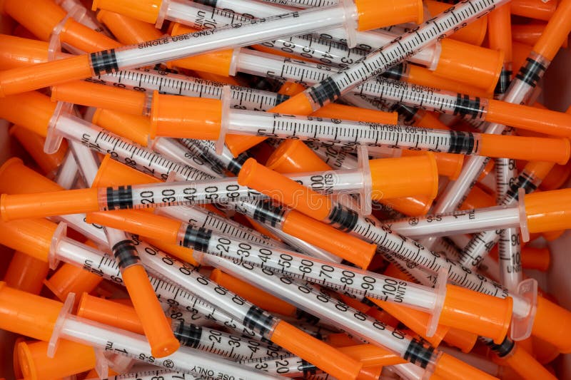 Pile of Insulin Needles with Orange Caps Stock Image Image of needles