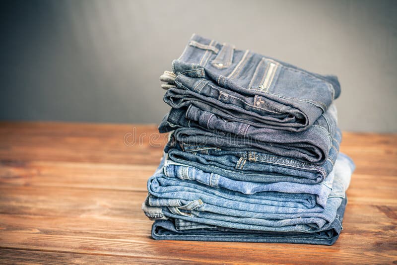 Pile of jeans stock image. Image of fabric, style, texture - 85622619