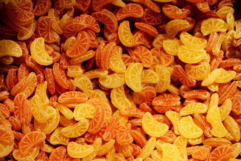 Pile of Lemon and Orange Hard Candies in a Candies Store Stock Image