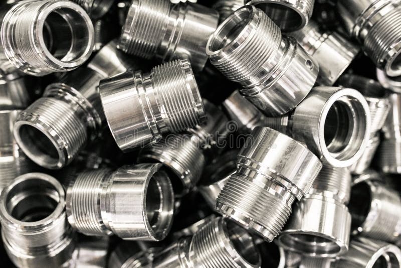 A pile of metal parts, CNC machine blanks. Pile of many CNC turning engineering parts. Closeup machine tool stock images, royalty-free photos and pictures