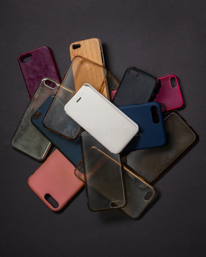 Pile Of Multicolored Plastic Back Covers For Mobile Phones On Black